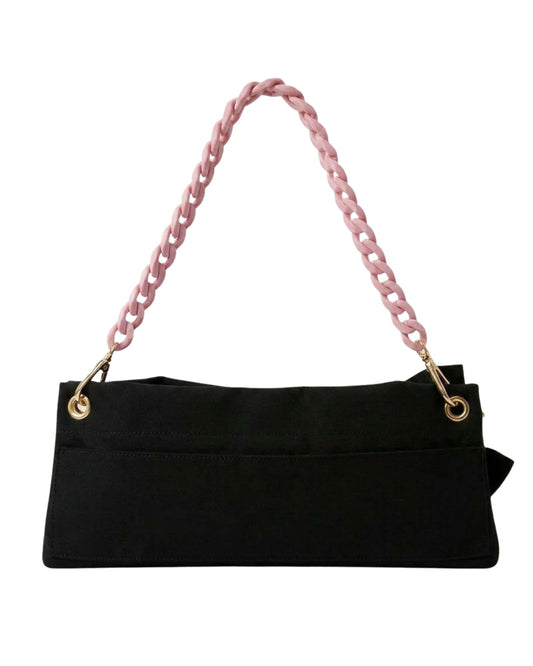 Back view of the Black Polka Edit pointe shoe bag — velcro back pocket, gold hardware eyelets and pink chain strap, by PointeBag By Ballerina