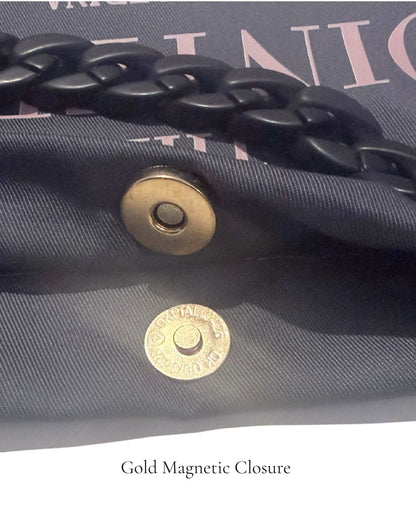Close-up of gold magnetic closure on The PointeBag Classic Dark Grey — secure snap detail on 220g cotton canvas with black velvety chain, by PointeBag By Ballerina