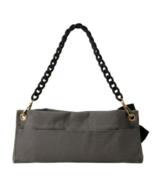 Back view of The PointeBag Dark Grey Polka Edit — velcro back pocket, gold hardware eyelets and black velvety chain strap, by PointeBag By Ballerina