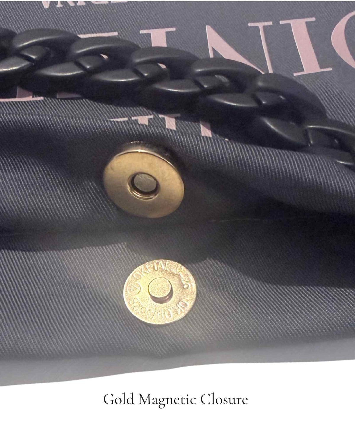 Close-up of gold magnetic closure on The PointeBag Dark Grey Polka Edit — secure snap detail on 220g dark grey cotton  with black velvety chain, by PointeBag By Ballerina