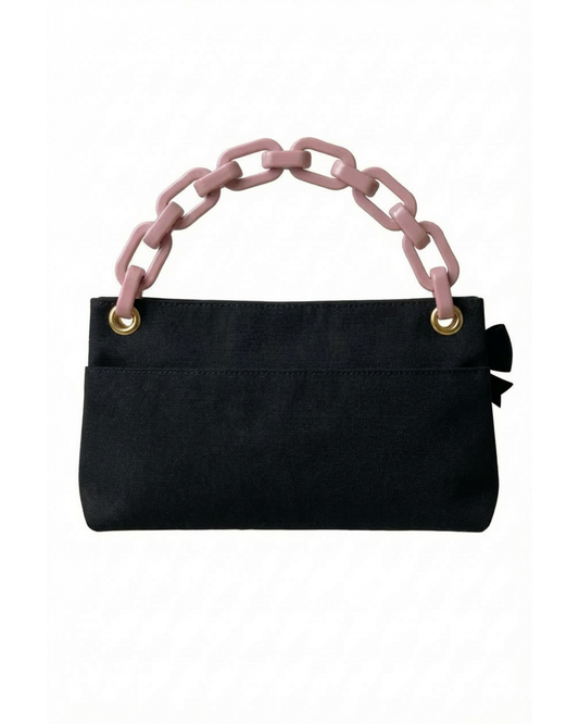 The back of our Black Classic PointeBag | Pointe Shoes Bag in Black Color with the logo PointeBag By Ballerina in pink color. The chain is light pink color.