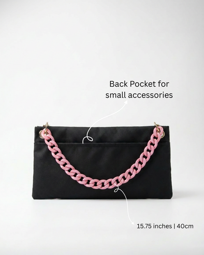 "Back view of The PointeBag By Ballerina in black — 15.75 inch ballet bag with back pocket for small accessories and pink chain strap"