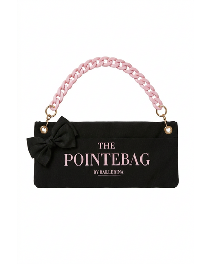 "The PointeBag By Ballerina in black — ballet bag with black bow and pink chain strap, gold hardware"