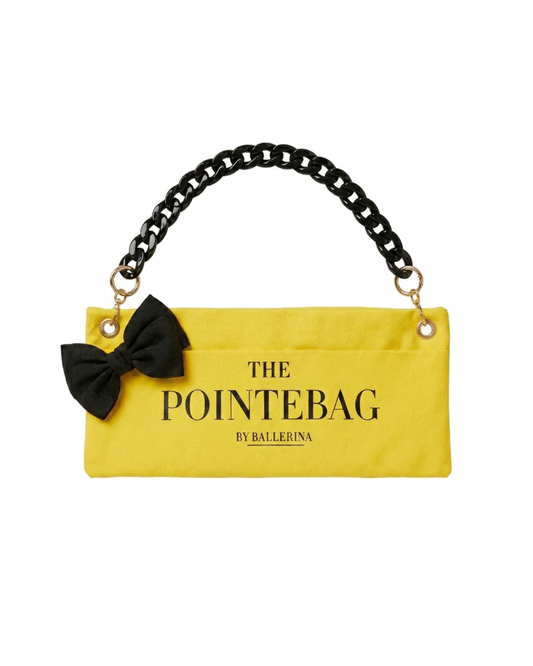 "The PointeBag By Ballerina in yellow — ballet bag with black bow and black chain strap & gold hardware.