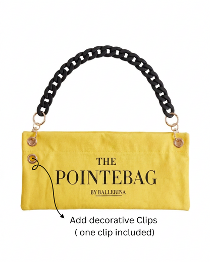 "The PointeBag By Ballerina in yellow — customizable ballet bag with decorative clip attachment and black chain strap, one clip included"
