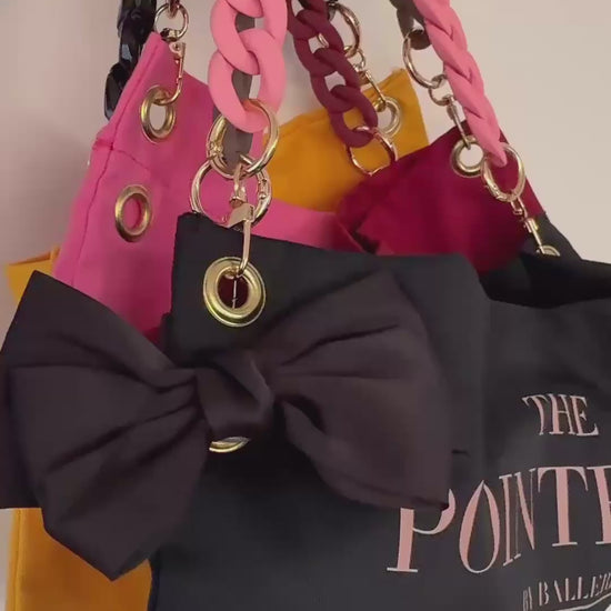 "Detail shot of The Black Classic PointeBag — cotton fabric and stylish chains and clips"