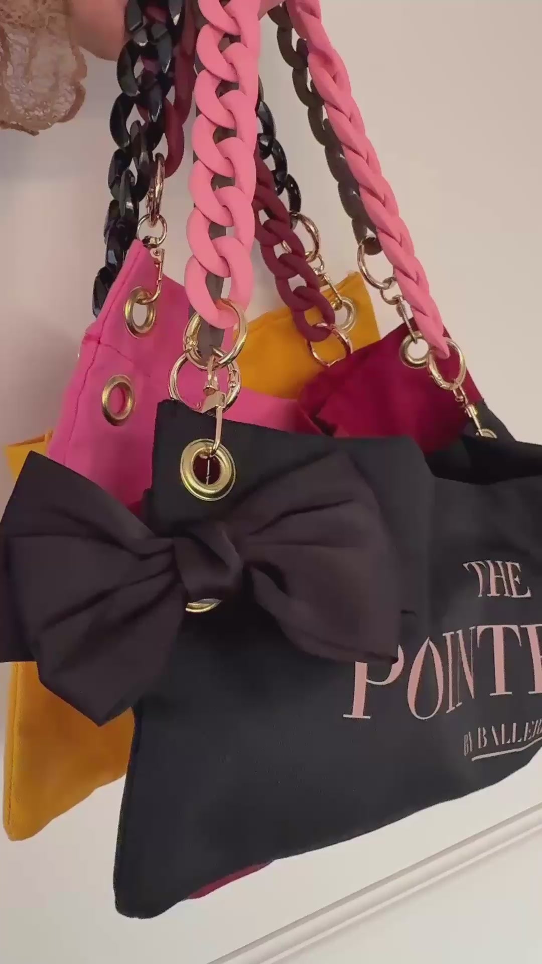 "Detail shot of The Black Classic PointeBag — cotton fabric and stylish chains and clips"
